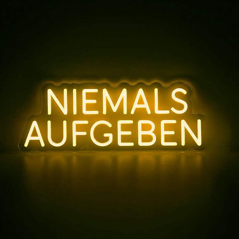 Niemals Aufgeben Neonschild Gold 50cm – warmer Schriftzug fürs Wohnzimmer