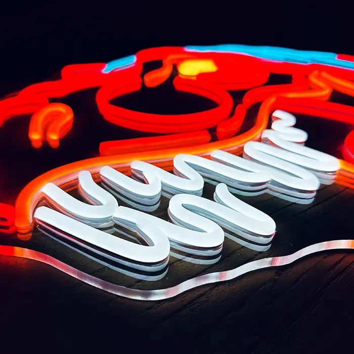 T-Rex Dino Neon LED Schild schräg in Nahaufnahme, weiße Zahnreihe plastisch auf klarem Acryl