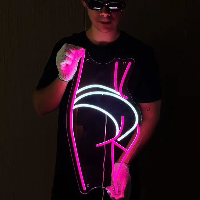 Sexy Boogie Neon LED Schild wird mit Handschuhen vor den Körper gehalten