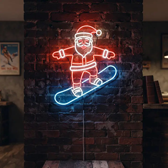 Weihnachtsmann mit Snowboard Neon LED Schild an einer Backsteinwand, Kabel nach unten geführt, rot und blau leuchtend
