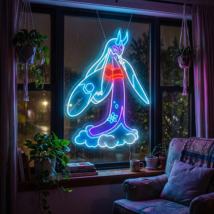 Pokémon Mega-Frosdedje Neon LED Schild in einem Fenster mit Hängepflanzen, davor ein Sessel