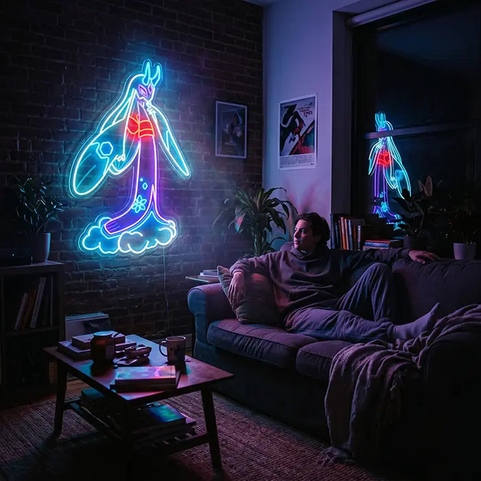 Pokémon Mega-Frosdedje Neon LED Schild an einer Backsteinwand über einem Mann auf dem Sofa, davor ein Couchtisch