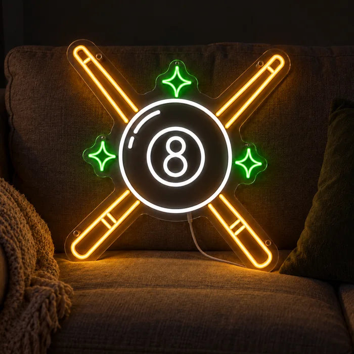 Billardkreuz Neon LED Schild auf einem gemütlichen Sofa zwischen Kissen und Decke