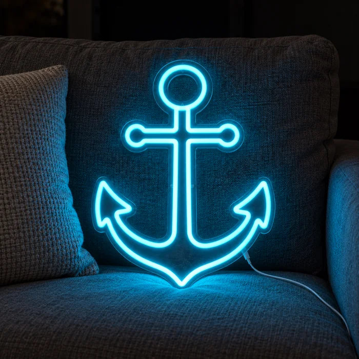 Hafenanker Neon LED Schild auf einem gemütlichen Sofa zwischen Kissen und Decke