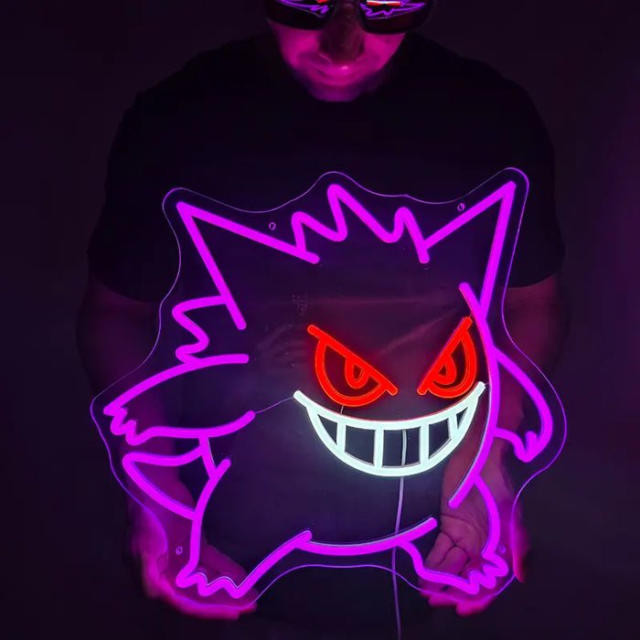 Pokémon Gengar Neon LED Schild lila leuchtend vor dunklem Hintergrund, mit orangefarbenen Augen und breitem Grinsen