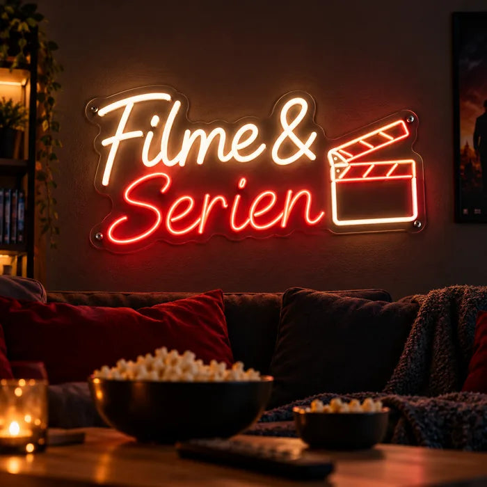 Neon LED Schild mit Schriftzug „Filme & Serien“ und Filmklappe in Warmweiß und Rot im Heimkino