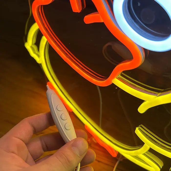Pokémon Enton Mittelfinger Neon LED Schild in Nahaufnahme, der Inline-Dimmer liegt in der Hand