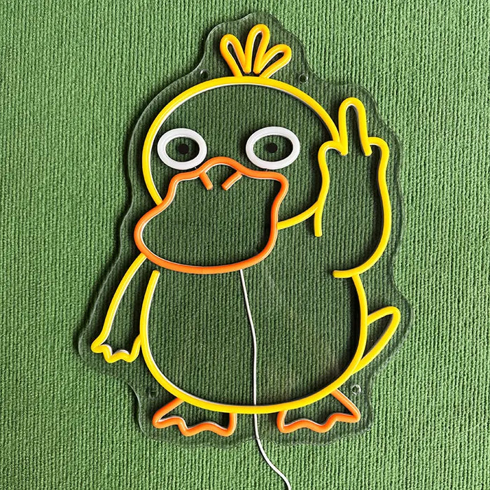 Pokémon Enton Mittelfinger Neon LED Schild ausgeschaltet auf grünem Untergrund, Kontur erkennbar