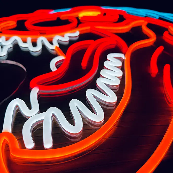 T-Rex Dino Neon LED Schild in Nahaufnahme, geöffnetes Maul mit Zunge und weißen Zähnen