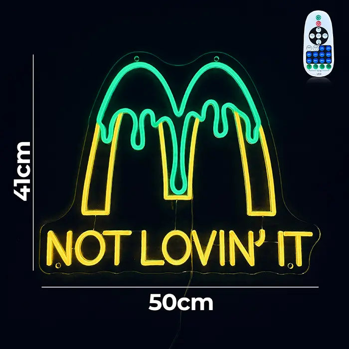 McDonald's Not Lovin' It Neon LED Schild mit Maßangaben 50 cm und 41 cm, daneben die Fernbedienung