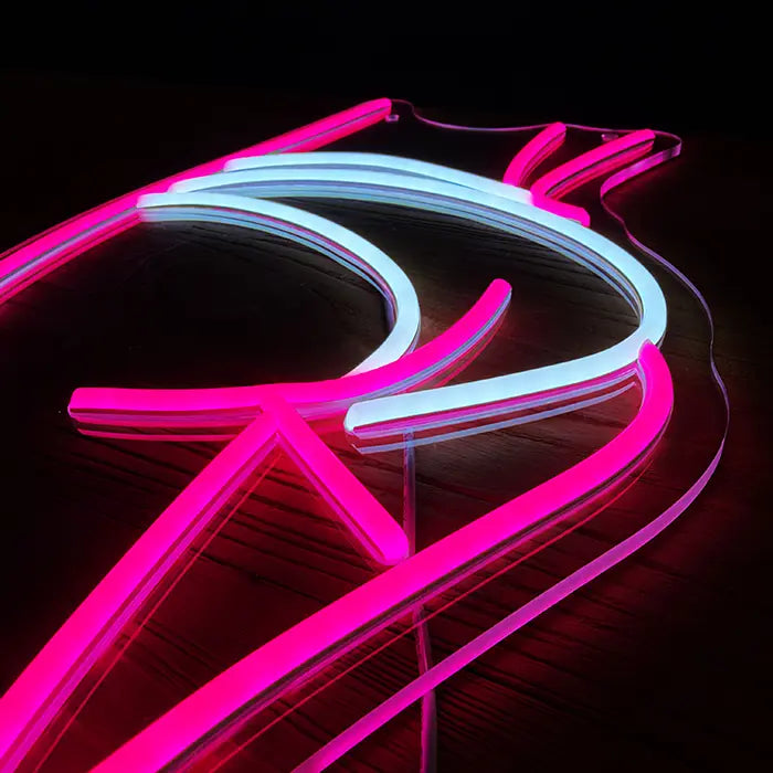 Sexy Boogie Neon LED Schild schräg von oben, pinke und weiße Neonschläuche auf klarem Acryl