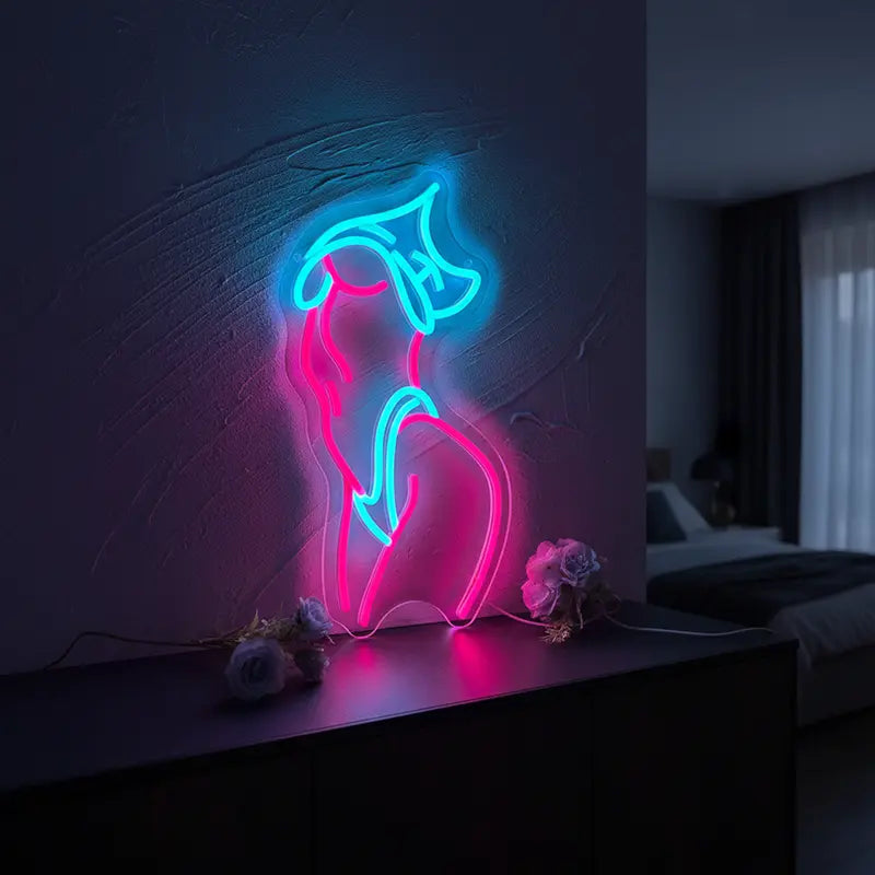 Dekoratives Neon-Licht mit einer sinnlichen Silhouette in Pink für eine künstlerische Ästhetik.
