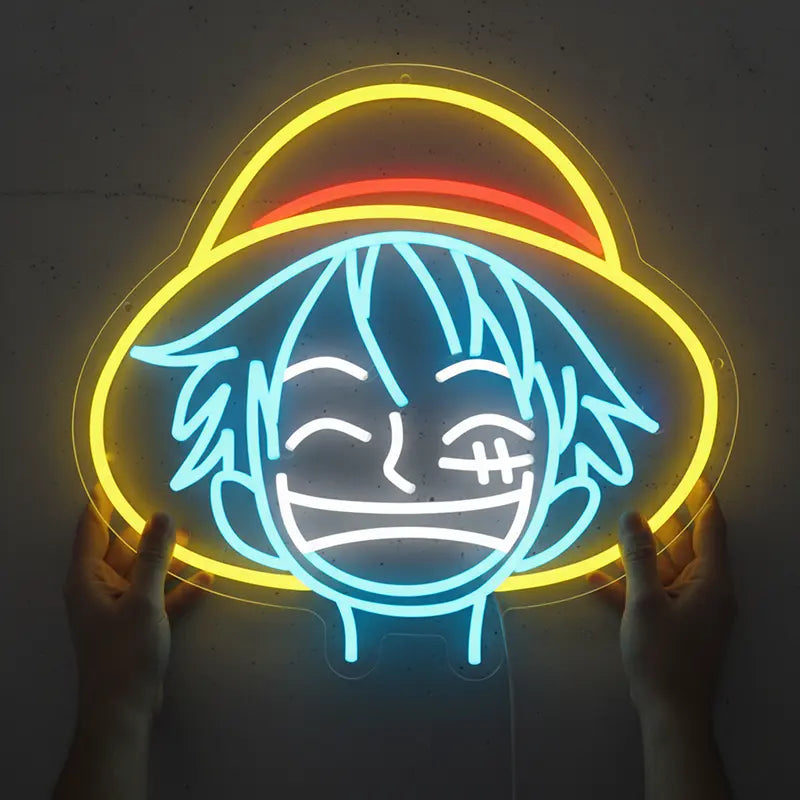 Detailreiches Luffy-Neon-Motiv in Blau, Gelb und Rot, das den Kopf des Strohhutpiraten darstellt.
