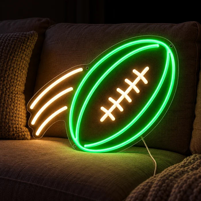 Football im Flug Neon LED Schild auf einem gemütlichen Sofa zwischen Kissen und Decke