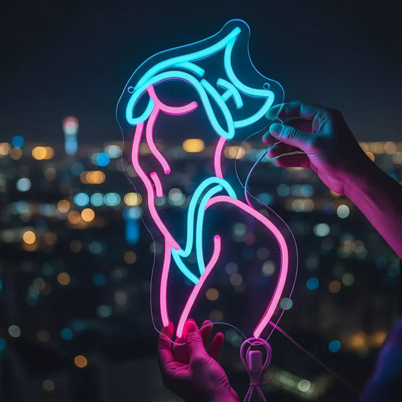 LED-Körperkunst als Neon-Kontur des weiblichen Körpers, leuchtend in hellem Pink und Blau
