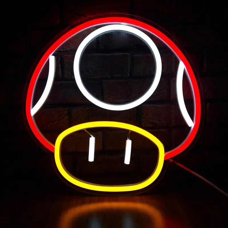 Neon-Schild in der Form des Superpilzes aus Super Mario, leuchtend in Rot, Weiß und Gelb auf einer Ziegelwand.
