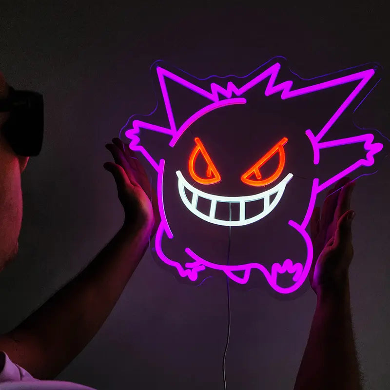 Leuchtendes Neon-Zeichen, das den Ghost-Typ Pokémon Gengar mit seinem charakteristischen Grinsen darstellt, perfektes Anime-Fan-Merch
