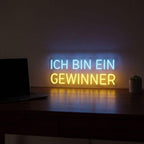 Custom-made Neon-Schild mit dem Gewinner-Motto, ideal als Geschenk für Unternehmer oder zur Stärkung des Selbstvertrauens.