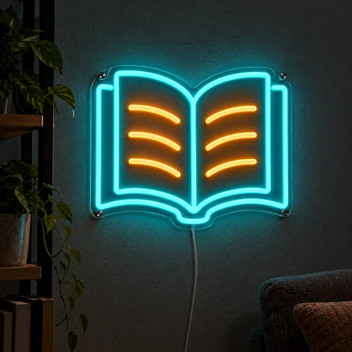 Lesebuch Neon LED Schild leuchtend an einer dunklen Wand, Nahaufnahme mit Anschlusskabel