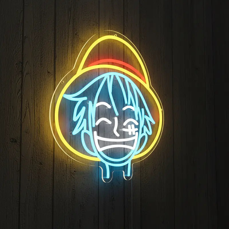Luffys Gesicht als Neon-Licht, wobei der charakteristische Strohhut in Gelb und Rot hervorgehoben wird.
