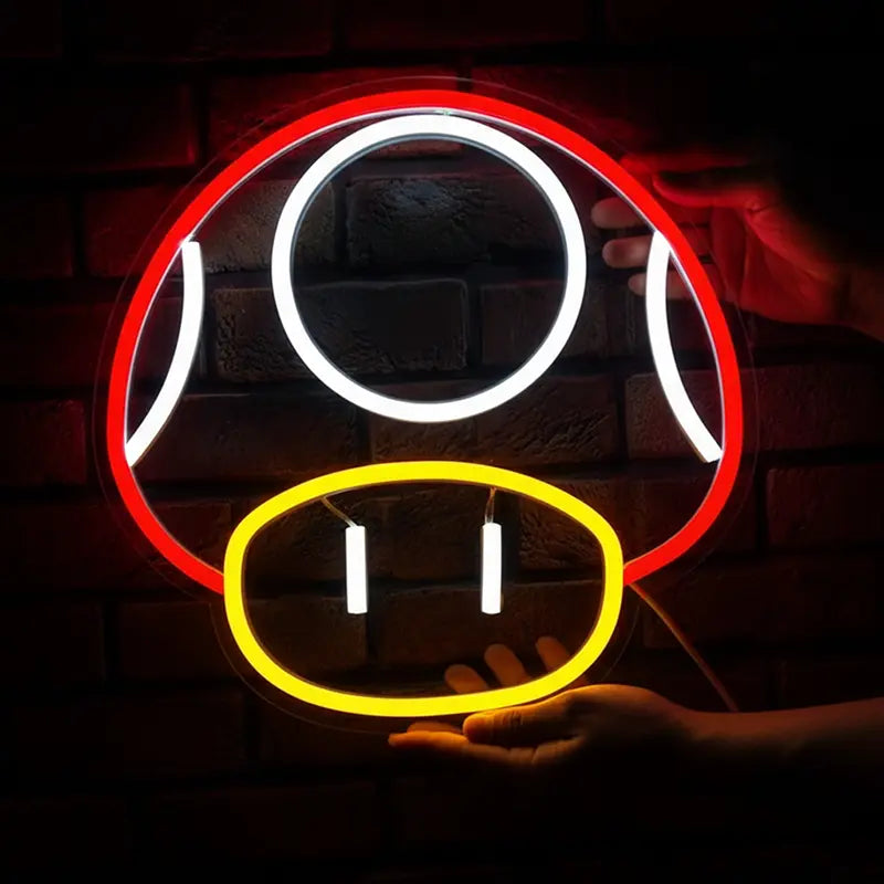 Neon-Licht in der Form des freundlichen Mario-Pilzes, mit rot-weißem Kopf und gelbem Sockel.
