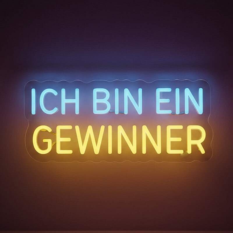 Inspirierender Leuchtschriftzug für das Büro oder Home-Gym, der eine positive Affirmation in hellen Neonfarben darstellt.