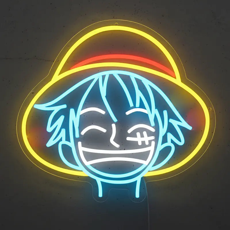 Neon-Schild mit dem lächelnden Gesicht von Monkey D. Luffy aus One Piece, beleuchtet in Blau und Weiß.
