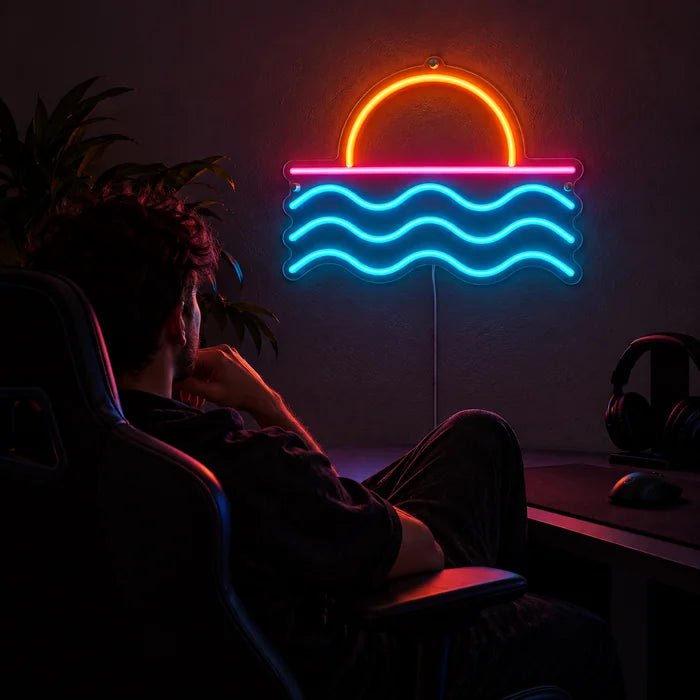 Sonnenuntergang am Meer Neon LED Schild über dem Gaming-Schreibtisch, davor ein Spieler im Gaming-Stuhl