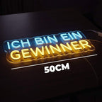 Deutscher Neon-Schriftzug "ICH BIN EIN GEWINNER" als auffälliges Wohnaccessoire, das einen optimistischen Fokus schafft.